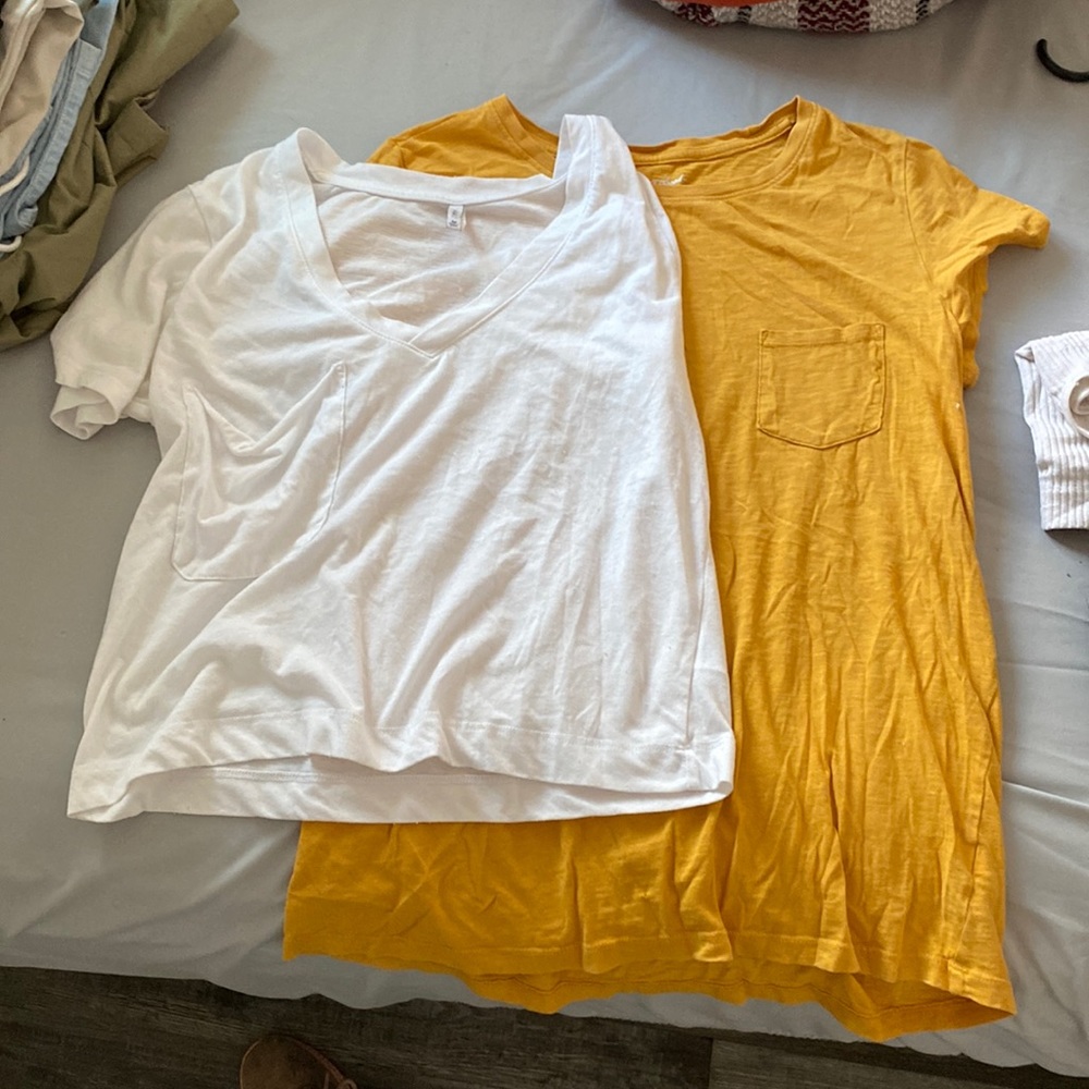 2 shirts (medium) with pockets. One yellow, one white